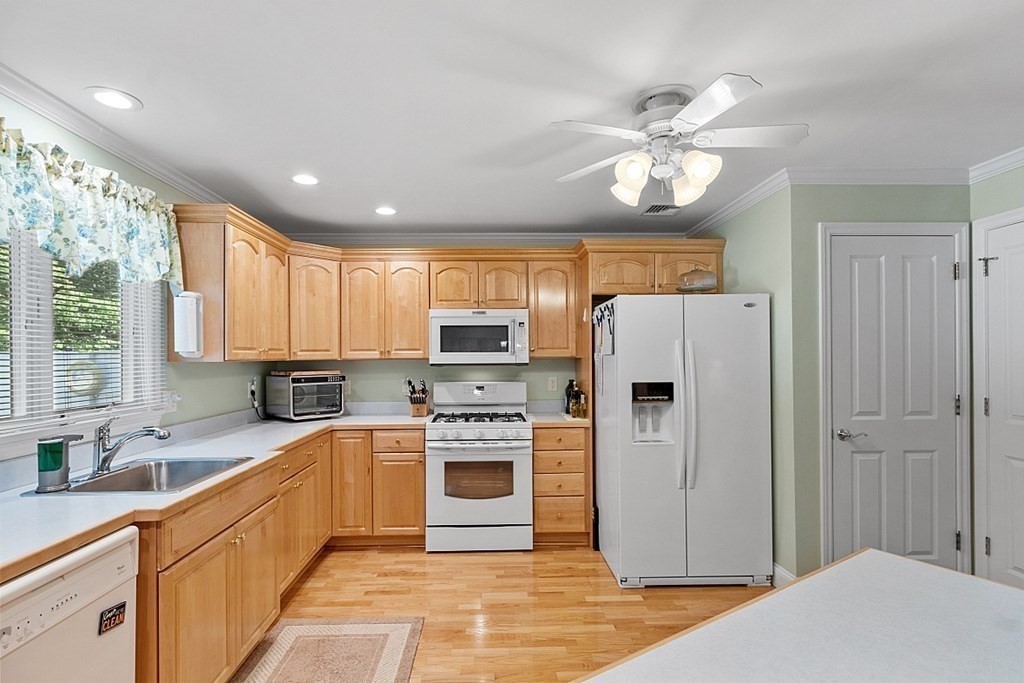 216 Rangeway Road, Unit 183 Billerica, MA 01862 - Photo 9 of 35 a kitchen with stainless steel appliances granite countertop a refrigerator a sink dishwasher a stove with open kitchen island