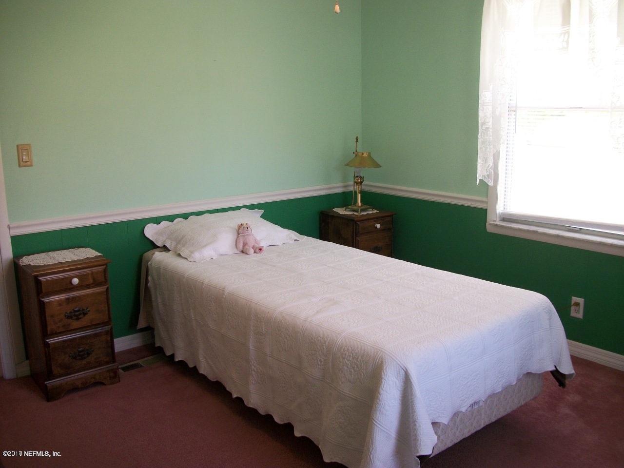 2855 Parrish Cemetery Road Jacksonville, FL 32221 - Photo 6 of 16 a bedroom with a bed and a window