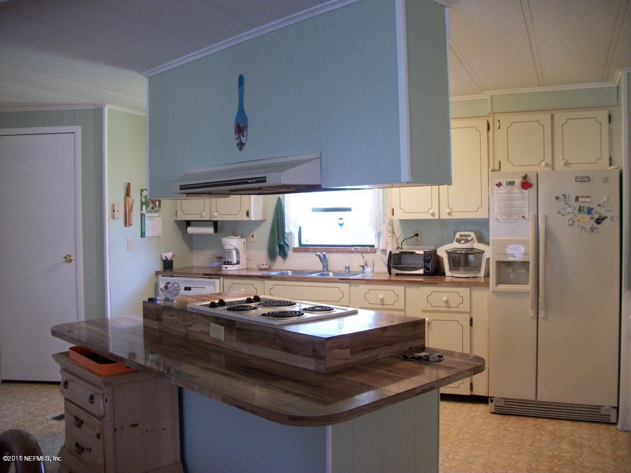 2855 Parrish Cemetery Road Jacksonville, FL 32221 - Photo 10 of 16 a kitchen with stainless steel appliances granite countertop a stove and a refrigerator