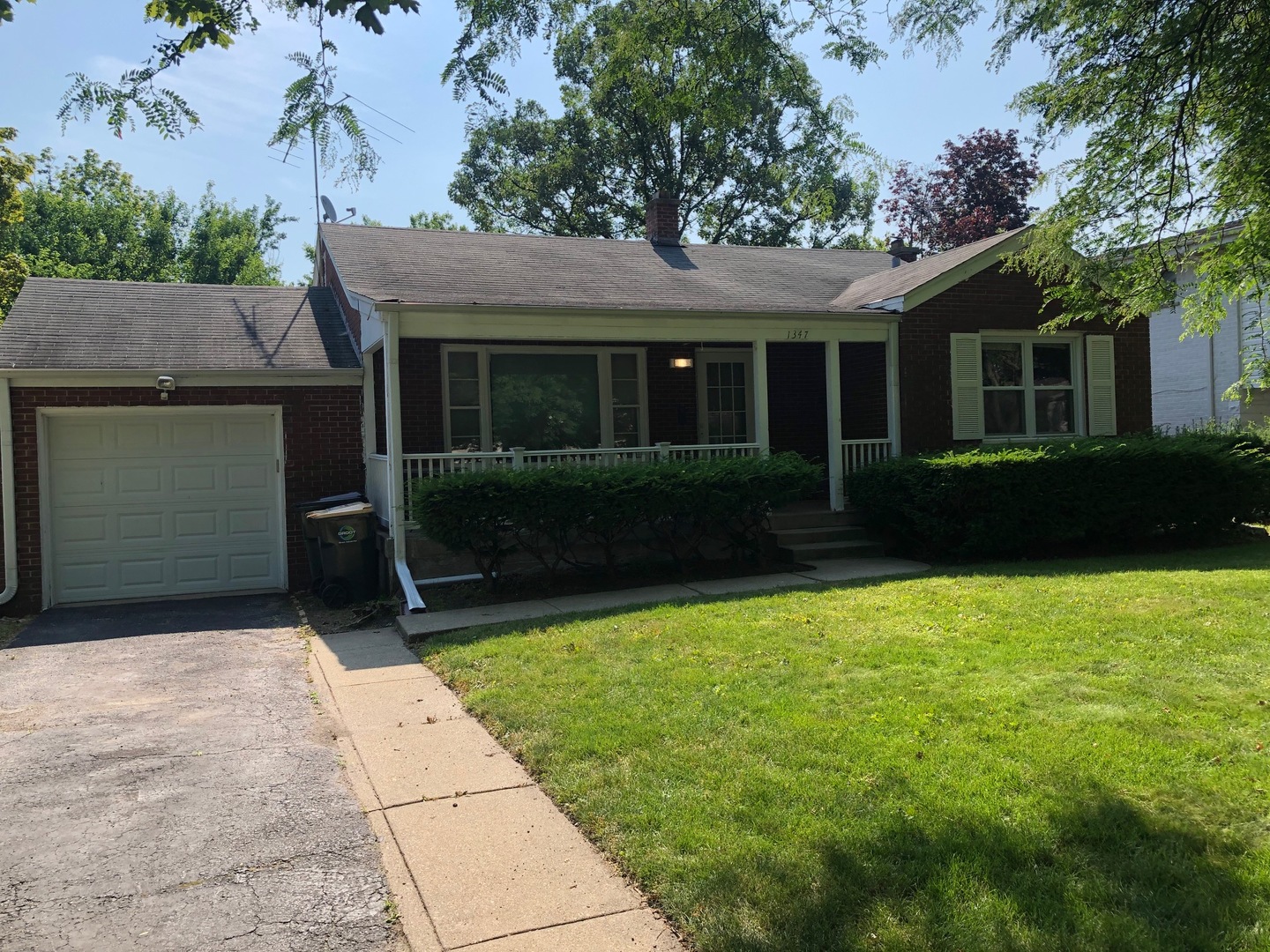 1347 Tyrell Avenue Park Ridge, IL 60068 - Photo 1 of 13 a front view of a house with garden