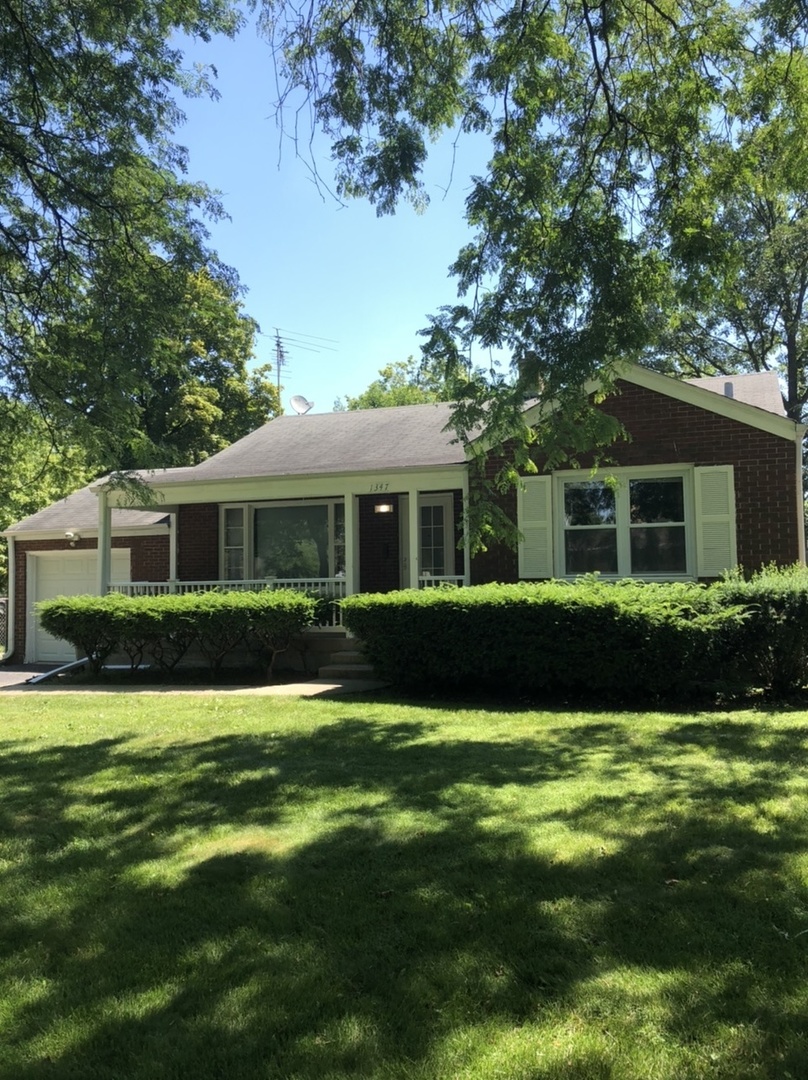 1347 Tyrell Avenue Park Ridge, IL 60068 - Photo 2 of 13 a front view of a house with a yard