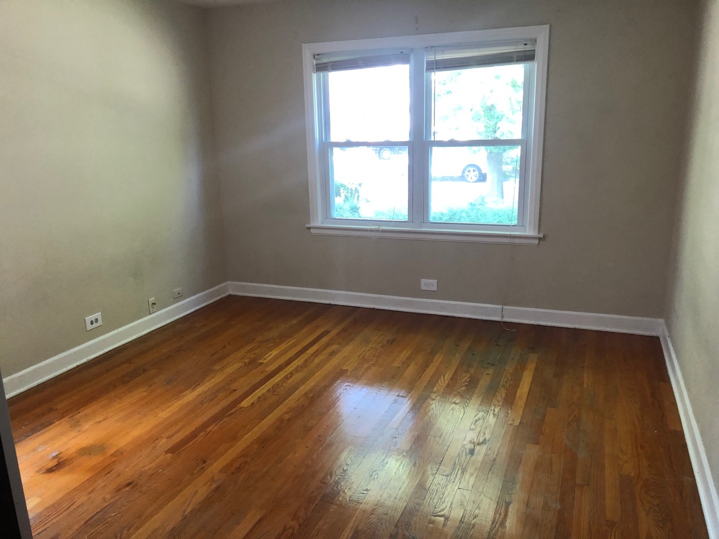 1347 Tyrell Avenue Park Ridge, IL 60068 - Photo 6 of 13 a view of a room with wooden floor and a window