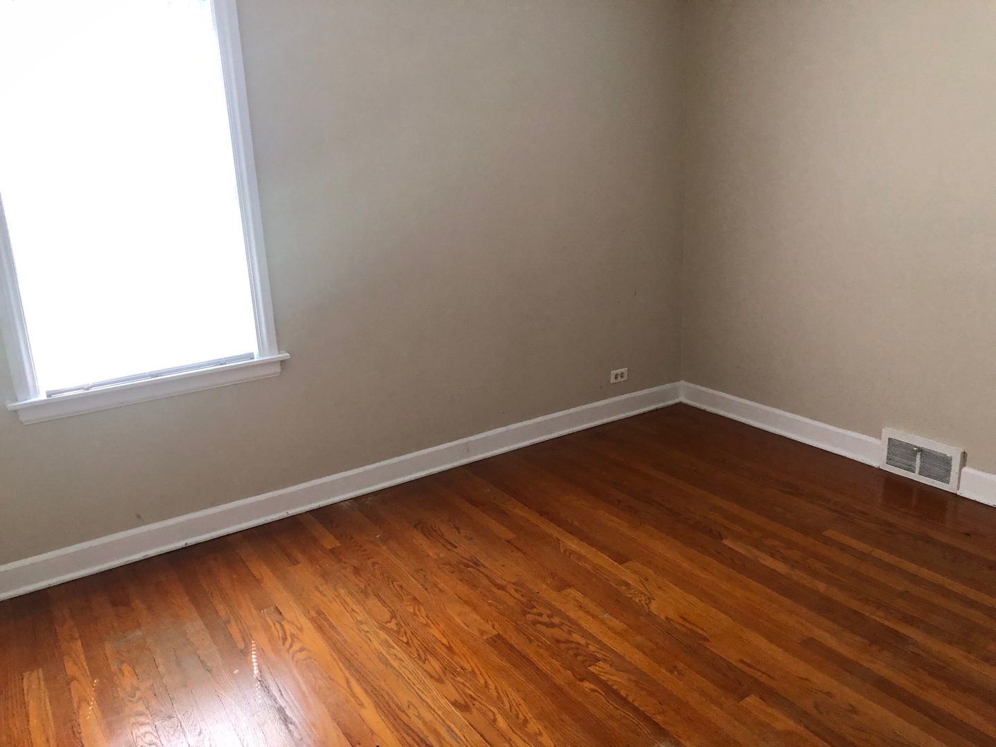 1347 Tyrell Avenue Park Ridge, IL 60068 - Photo 8 of 13 a view of a room with wooden floor and small window