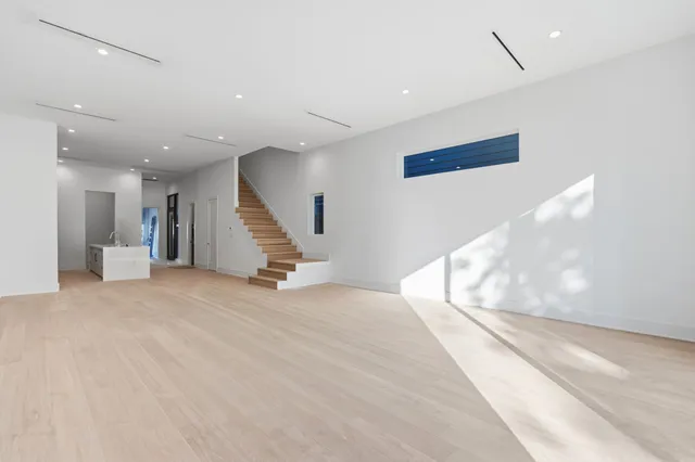 a view of an empty room with stairs