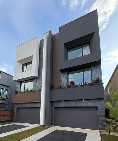 a front view of a house with garage