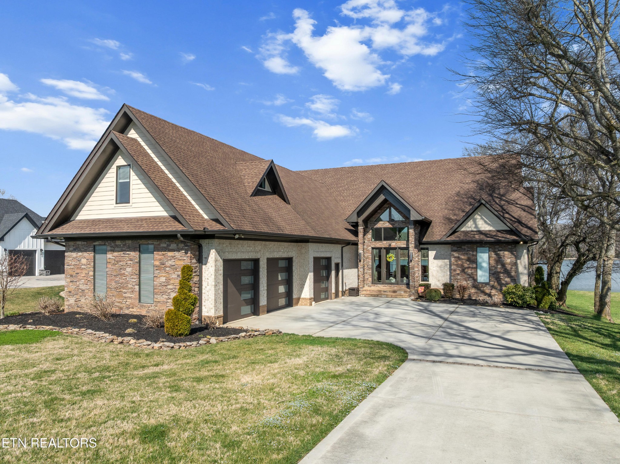 3702 Promontory Point Louisville, TN 37777 - Photo 1 of 60 a front view of a house with a yard