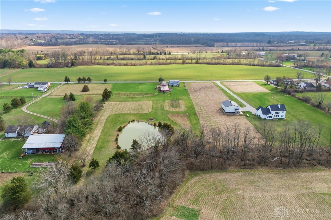 11379 Friend Road Germantown, OH 45327 - Photo 43 of 44 Expansive green fields with a pond, surrounding multiple properties.