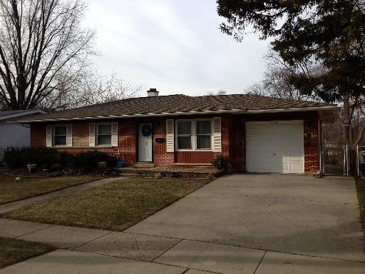338 Raupp Boulevard Buffalo Grove, IL 60089 - Photo 1 of 1 a front view of a house with a garden and patio