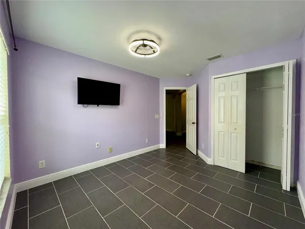 a view of an empty room with a bathroom