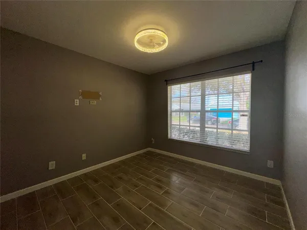 an empty room with a empty space and windows