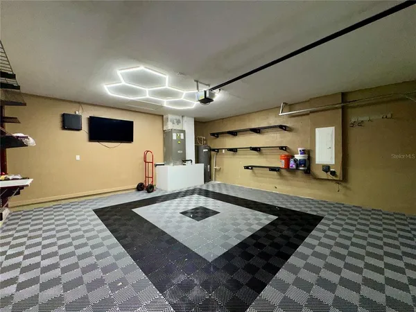 a living room with a rug and a table