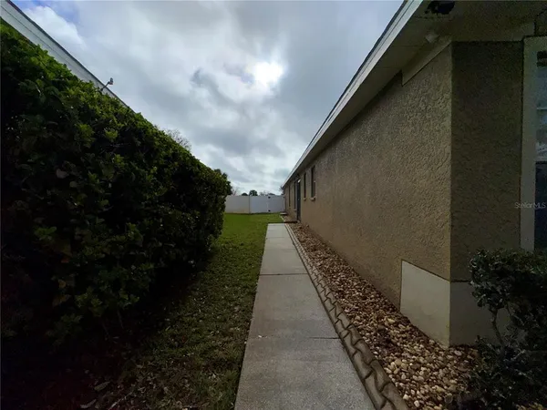 a view of a pathway in outside the house