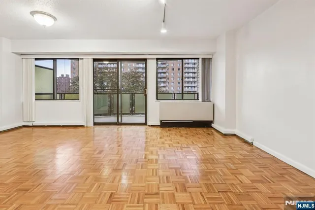 a view of an empty room with a window