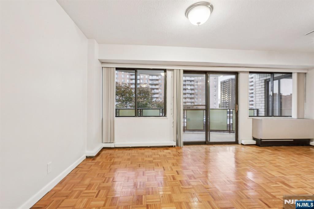 150 Overlook Avenue, Unit 6H Hackensack, NJ 07601 - Photo 15 of 29 a view of an empty room with glass door