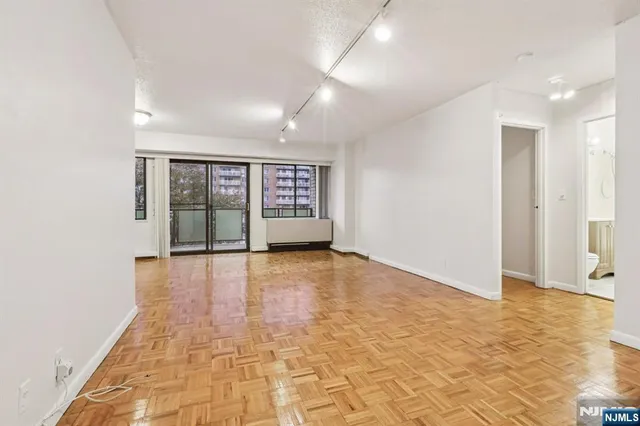 a view of an empty room with a window