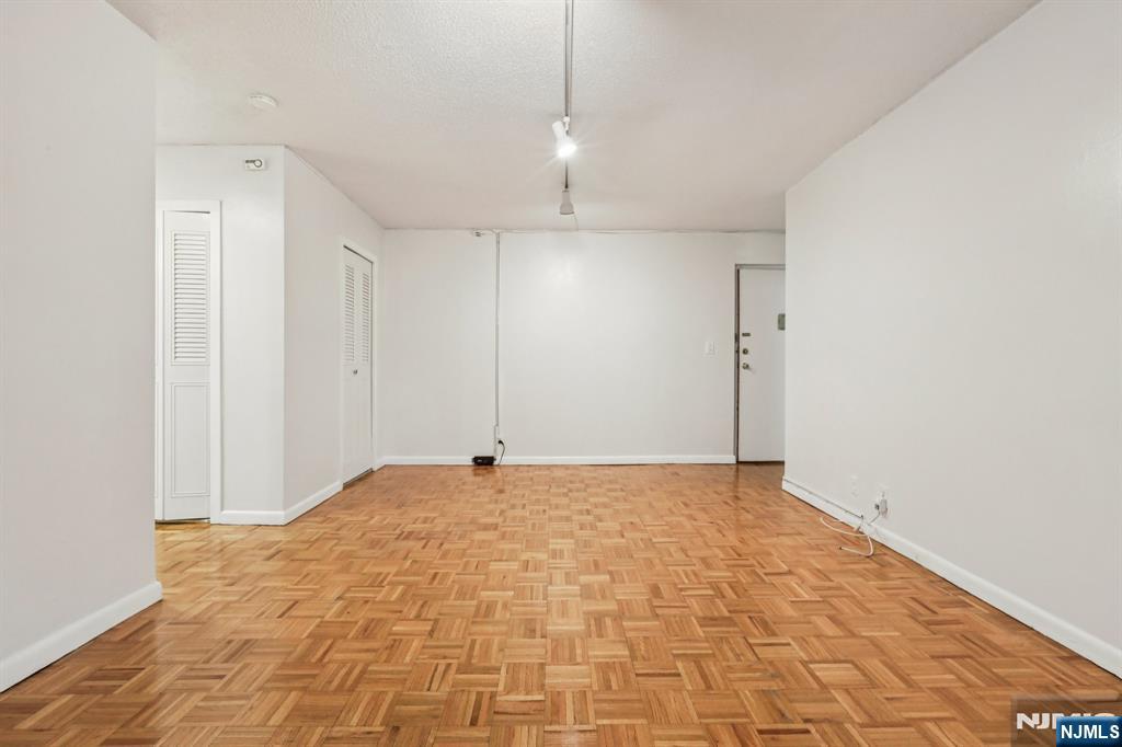 150 Overlook Avenue, Unit 6H Hackensack, NJ 07601 - Photo 8 of 29 a view of an empty room with a fan