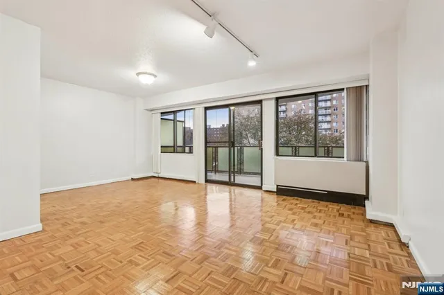 a view of an empty room with a window