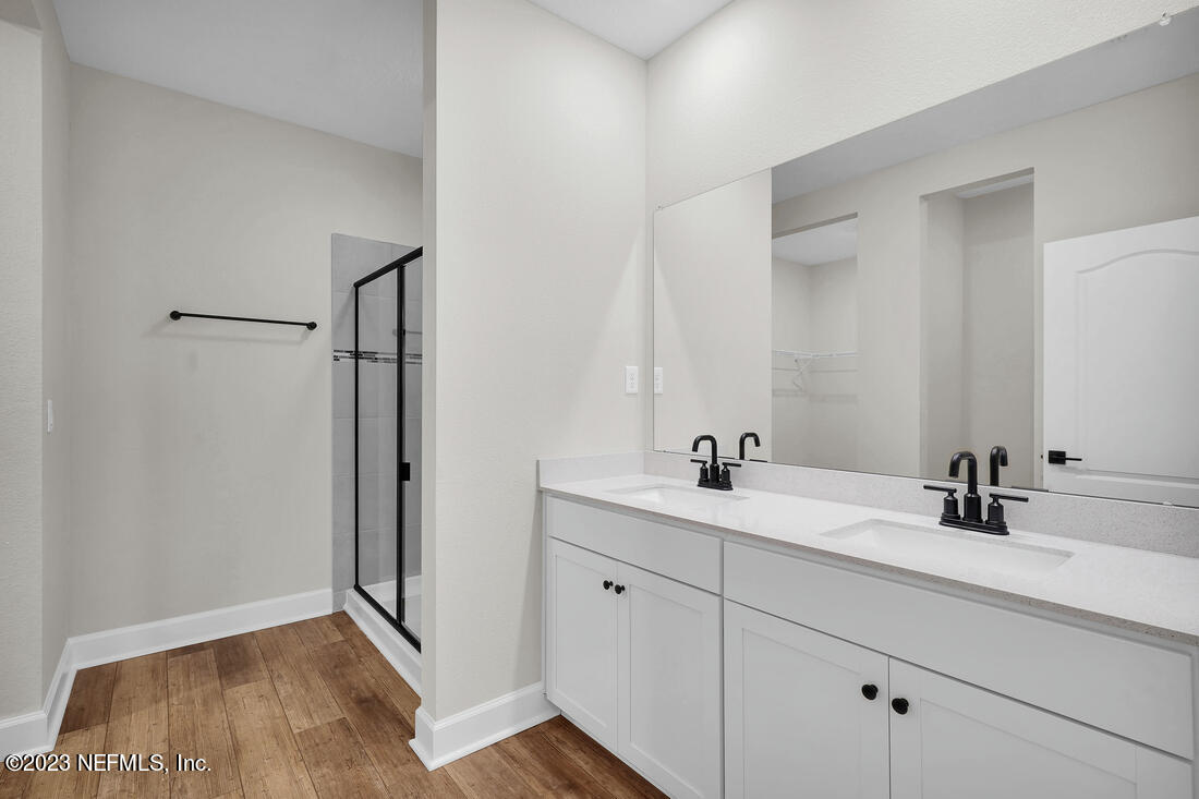 748 Morgans Treasure Road St. Augustine, FL 32084 - Photo 8 of 10 a bathroom with a sink and a mirror