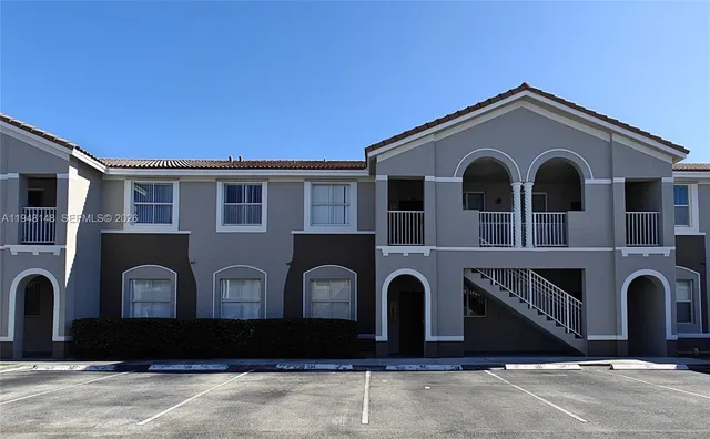 a front view of a house with garage
