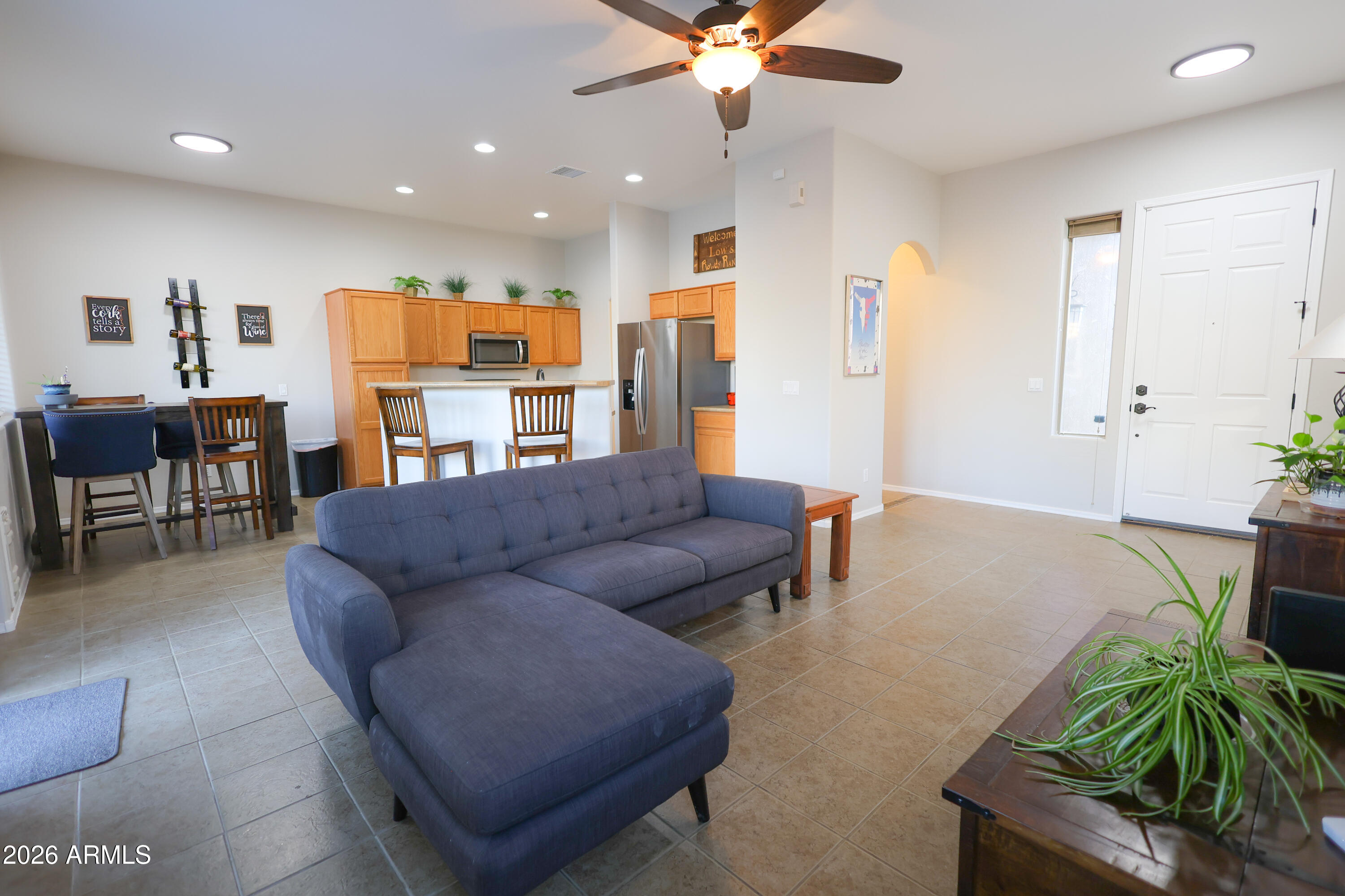 596 Rowdy Ranch Road Camp Verde, AZ 86322 - Photo 4 of 38 a living room with furniture and a potted plant