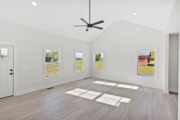 1030 Hanestown Road Lafayette, TN 37083 - Photo 12 of 48 a view of an empty room with a window and wooden floor