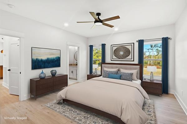 1030 Hanestown Road Lafayette, TN 37083 - Photo 25 of 48 a bedroom with a bed and a chandelier