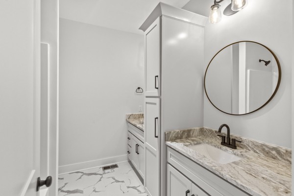 1030 Hanestown Road Lafayette, TN 37083 - Photo 28 of 48 a bathroom with a granite countertop sink mirror and vanity
