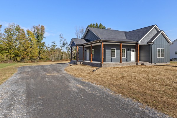 1030 Hanestown Road Lafayette, TN 37083 - Photo 3 of 48 a view of a house with a yard