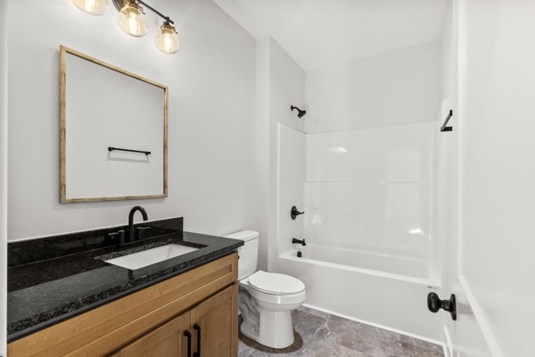 1030 Hanestown Road Lafayette, TN 37083 - Photo 32 of 48 a bathroom with a granite countertop sink toilet and shower