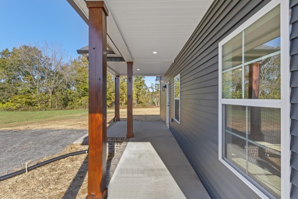 1030 Hanestown Road Lafayette, TN 37083 - Photo 5 of 48 a view of balcony with floor to ceiling windows and yard