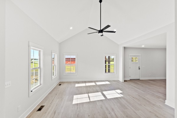 1030 Hanestown Road Lafayette, TN 37083 - Photo 10 of 48 a view of empty room with wooden floor and window