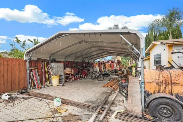 a view of a chairs and table in a patio