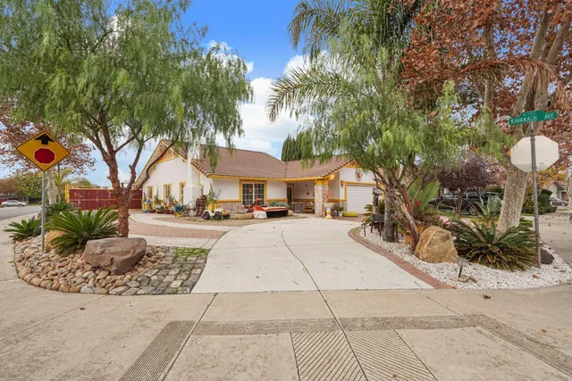 a view of house with outdoor space and sitting area