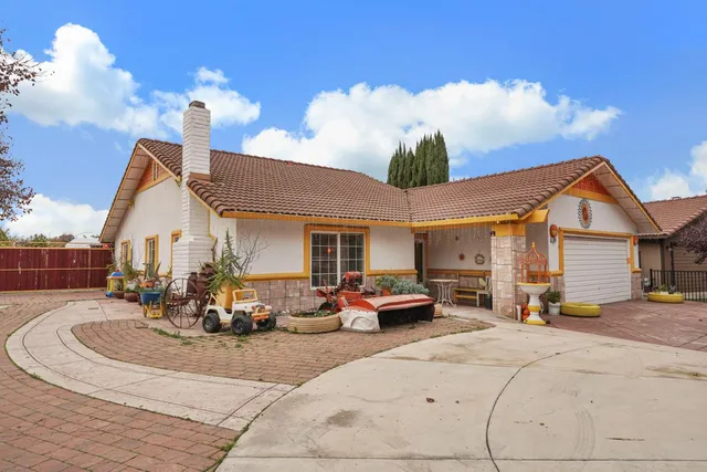 a view of a house with sitting area and furniture