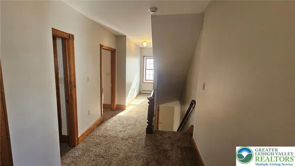 a view of a hallway with windows