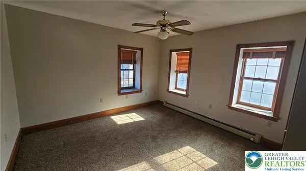 a view of an empty room with a window