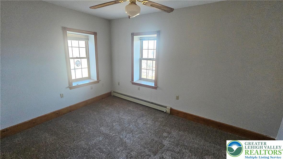 253 West Main Street Bath, PA 18014 - Photo 15 of 30 an empty room with windows and fan