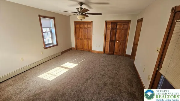 a view of empty room with windows