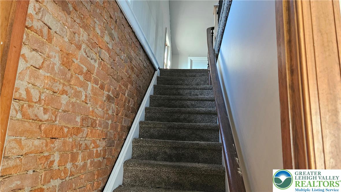 253 West Main Street Bath, PA 18014 - Photo 20 of 30 a view of staircase with white walls and windows