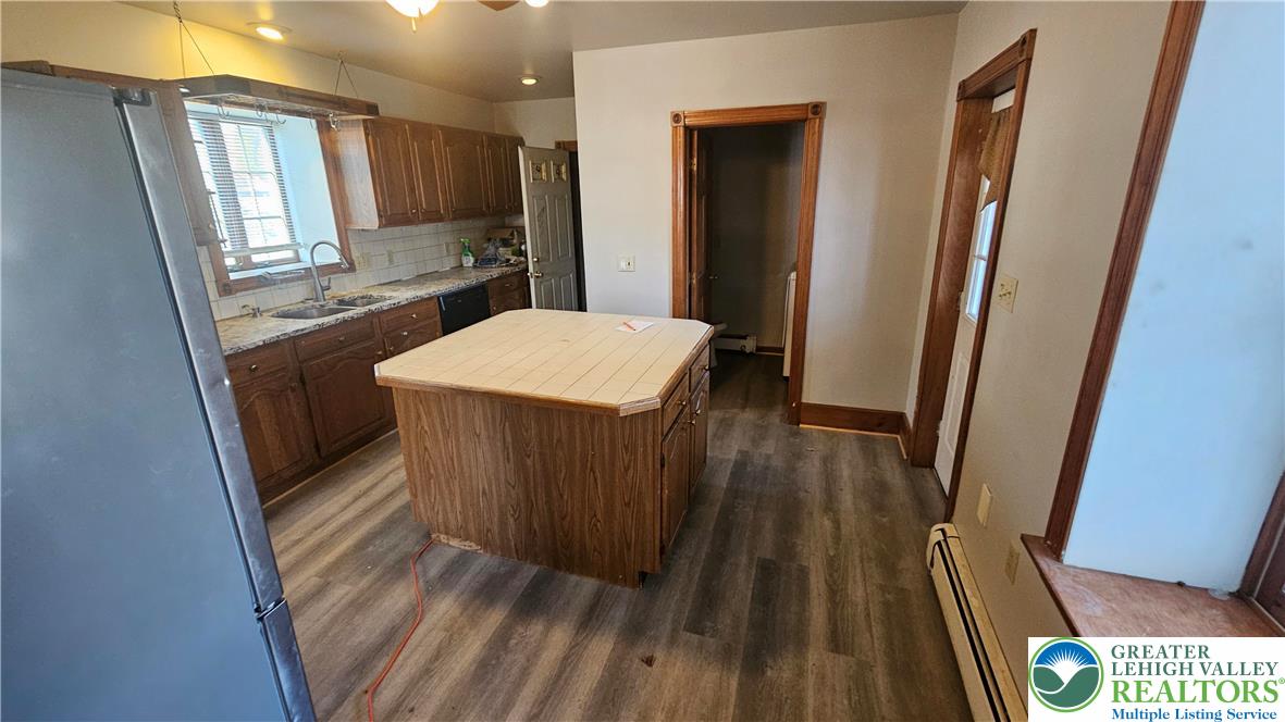 253 West Main Street Bath, PA 18014 - Photo 4 of 30 a very nice looking room with wooden floor and a large window