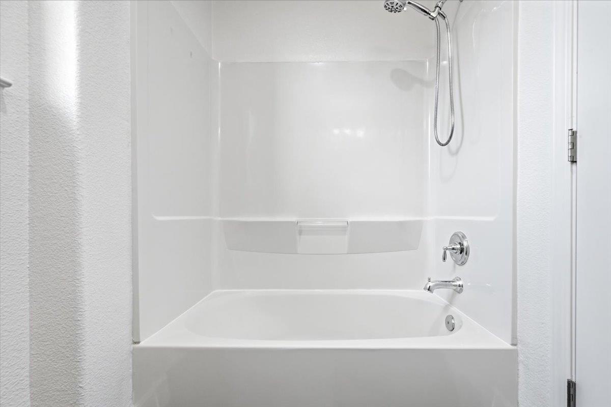5614 Oceanspray Road Newark, CA 94560 - Photo 24 of 52 a close up of a bathtub in a bathroom