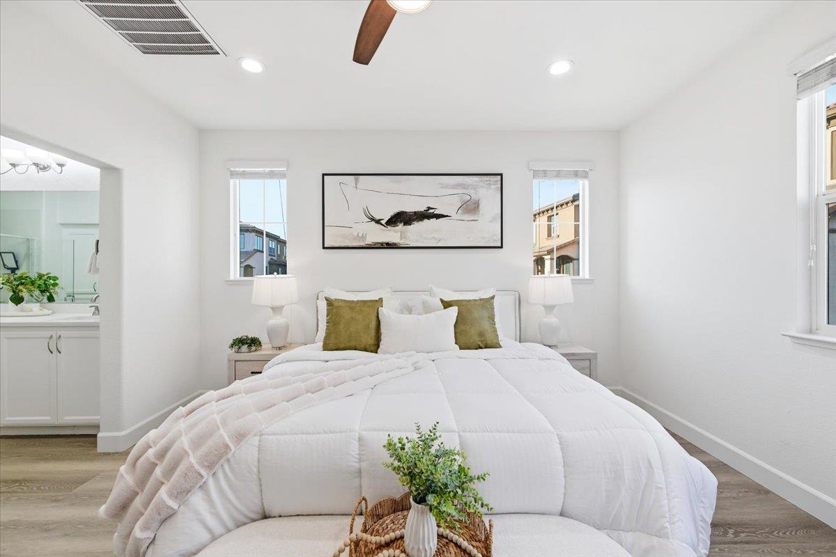5614 Oceanspray Road Newark, CA 94560 - Photo 26 of 52 a bedroom with a bed and a painting on the wall