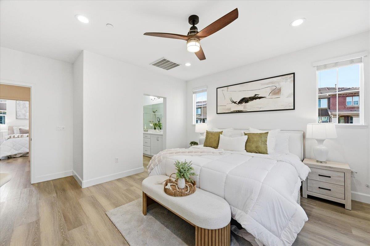 5614 Oceanspray Road Newark, CA 94560 - Photo 27 of 52 a bedroom with a bed and wooden floor