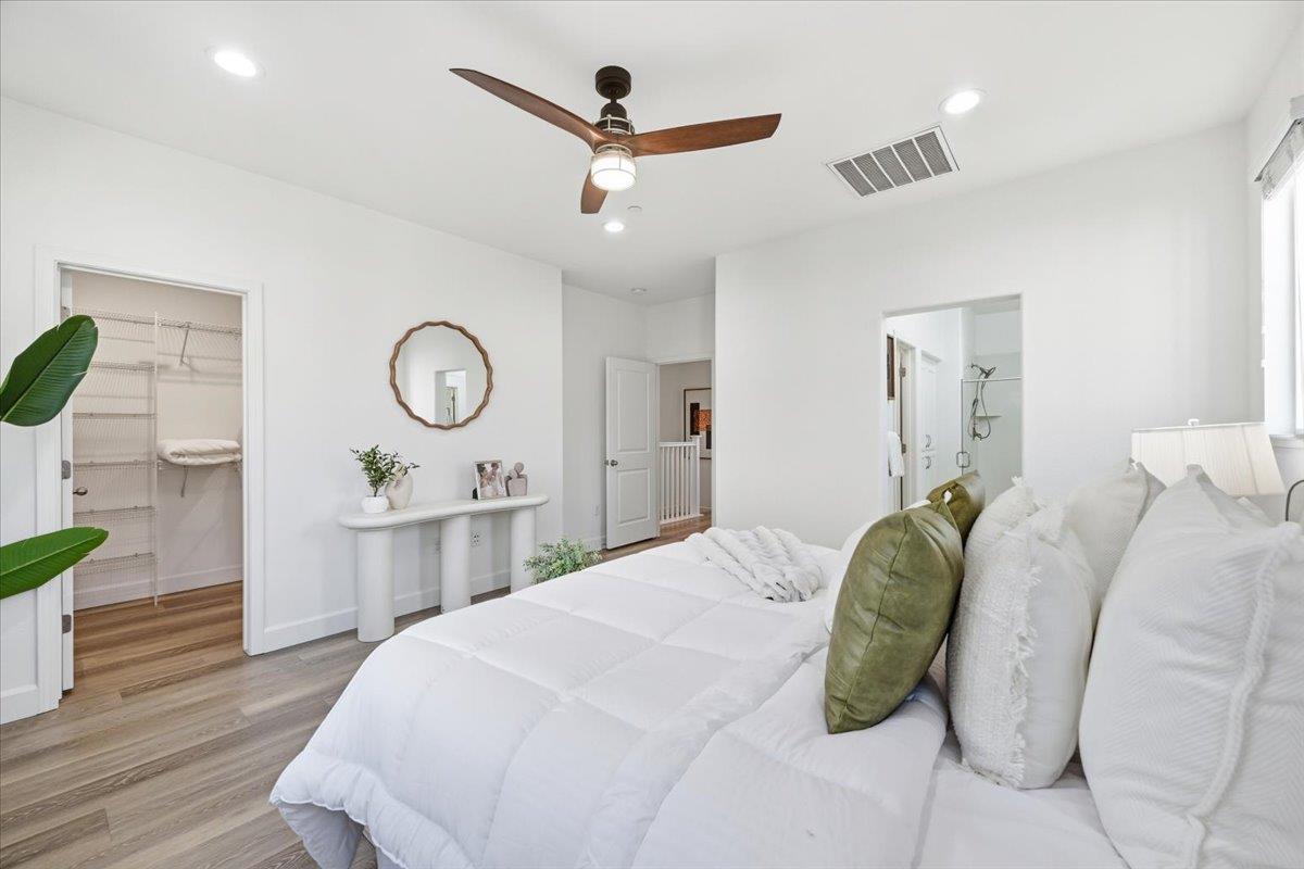 5614 Oceanspray Road Newark, CA 94560 - Photo 28 of 52 a bedroom with a bed and wooden floor