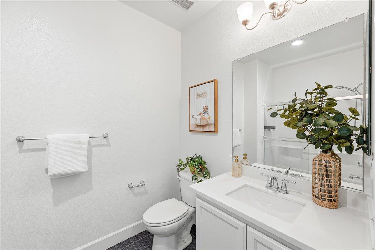 5614 Oceanspray Road Newark, CA 94560 - Photo 36 of 52 a bathroom with a sink a toilet and a mirror