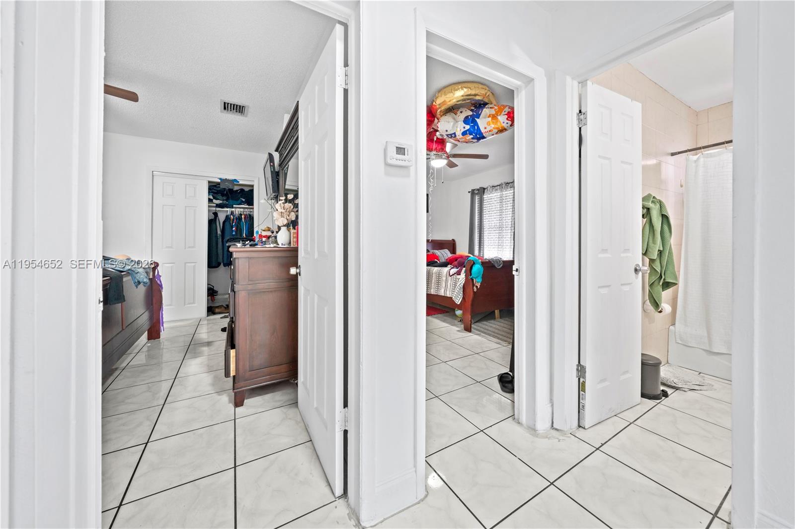 2110 Northwest 34th Street Miami, FL 33142 - Photo 14 of 33 a view of a hallway with dining area and windows