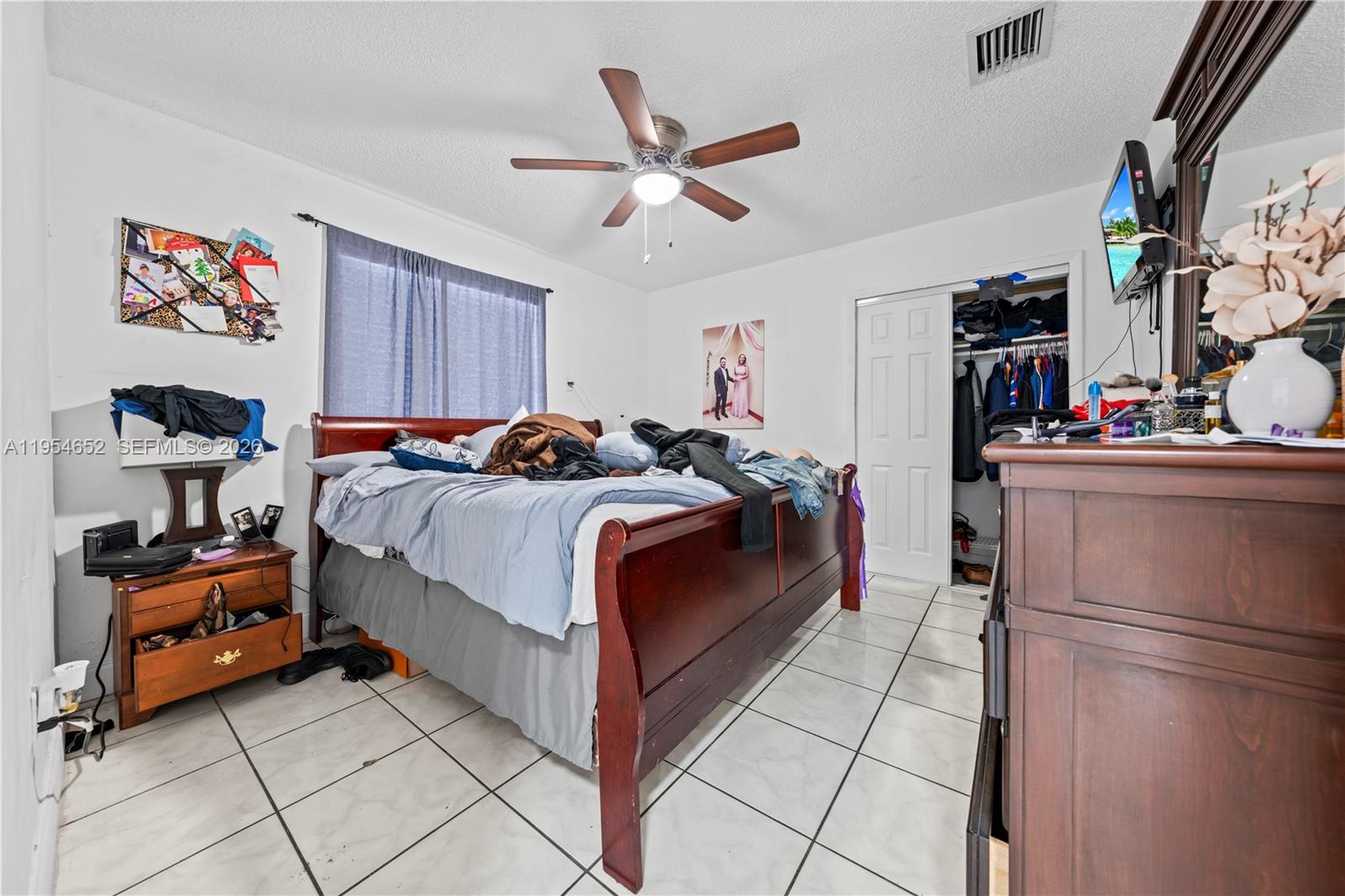 2110 Northwest 34th Street Miami, FL 33142 - Photo 16 of 33 a bedroom with a bed and cabinets