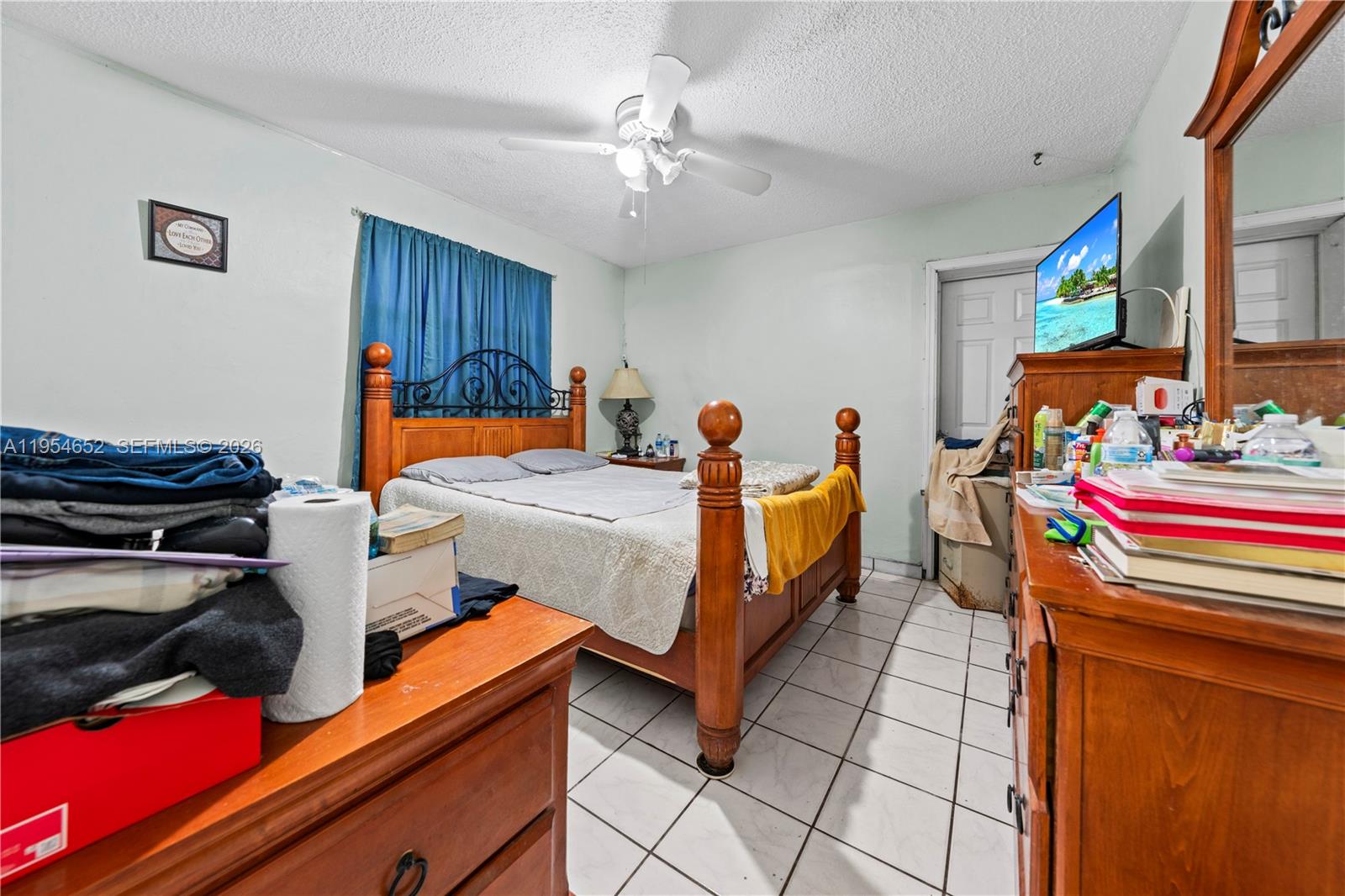2110 Northwest 34th Street Miami, FL 33142 - Photo 22 of 33 a bed room with bed and window