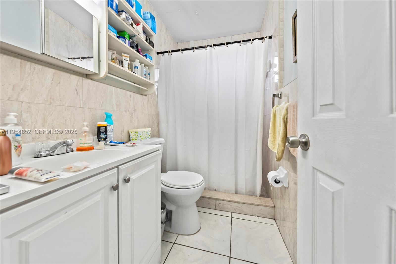 2110 Northwest 34th Street Miami, FL 33142 - Photo 24 of 33 a bathroom with a sink toilet and shower