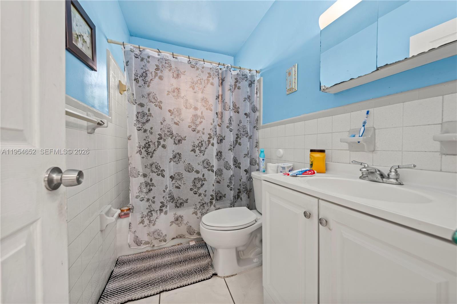 2110 Northwest 34th Street Miami, FL 33142 - Photo 30 of 33 a bathroom with a sink toilet and shower